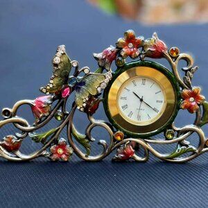 DECORATIVE QUARTZ CLOCK WITH FLORAL ACCENTS   NOWT